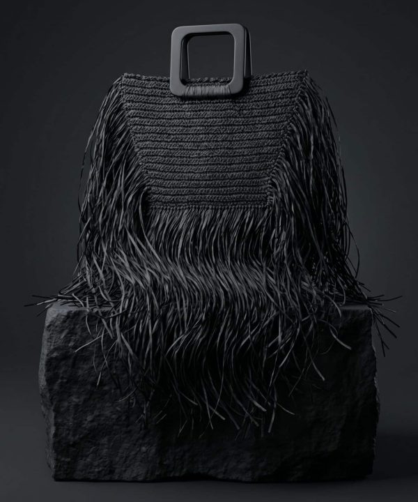 Leila Black Fringe Handbag siyah püsküllü el çantası doğal ışıkta mermer platform üzerinde lüks kadın aksesuarı